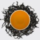 Royal Peach Orchid, tea leaves and steeped liquor